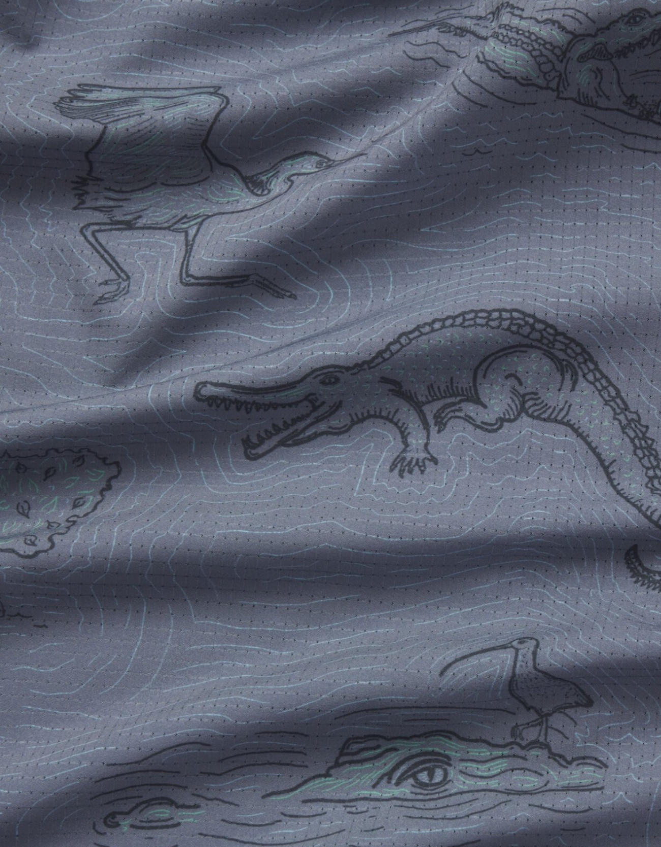 Gray fabric with crocodile and bird illustrations
