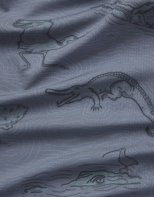 Gray fabric with crocodile and bird illustrations