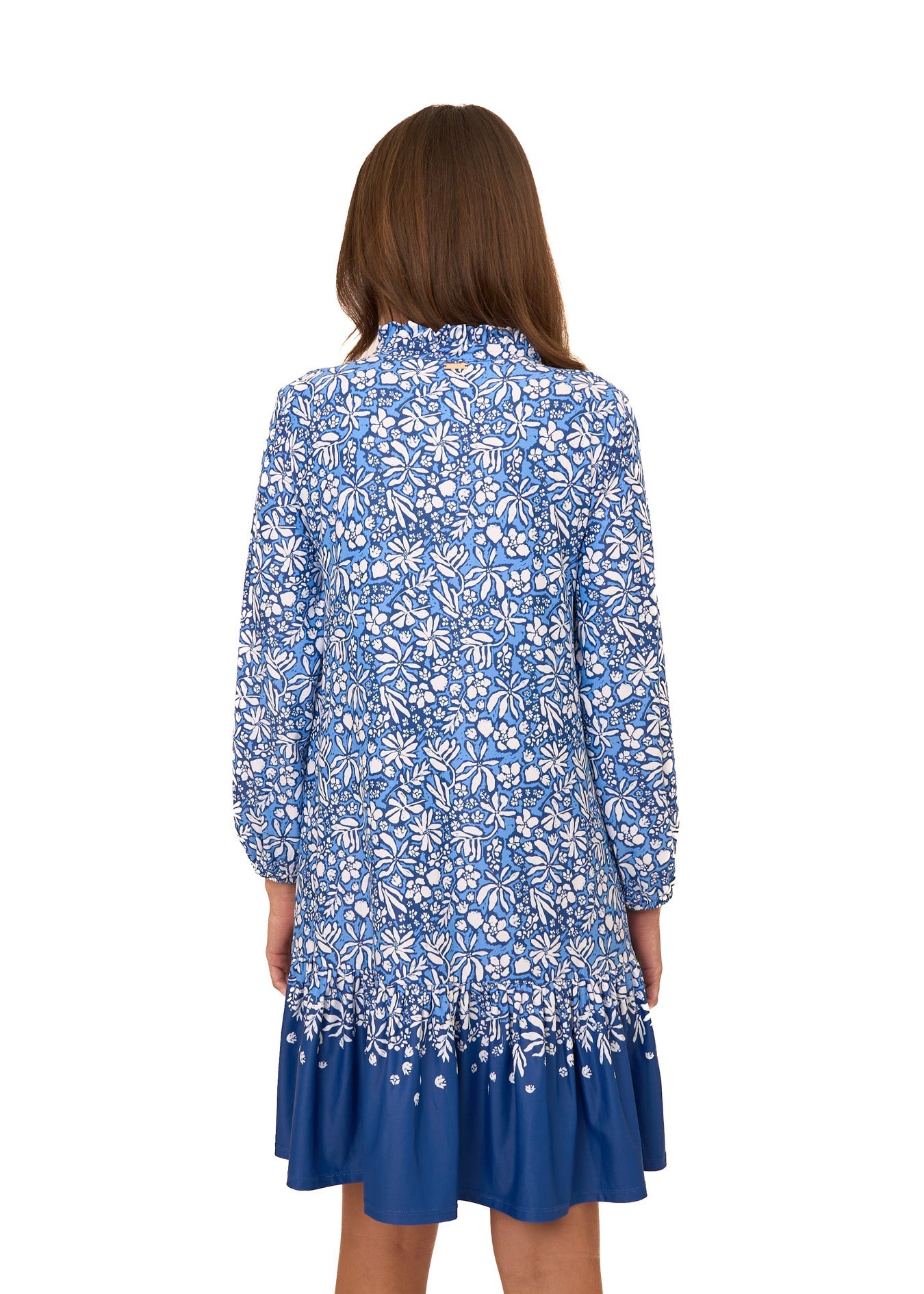 Woman wearing a blue floral dress on a white background