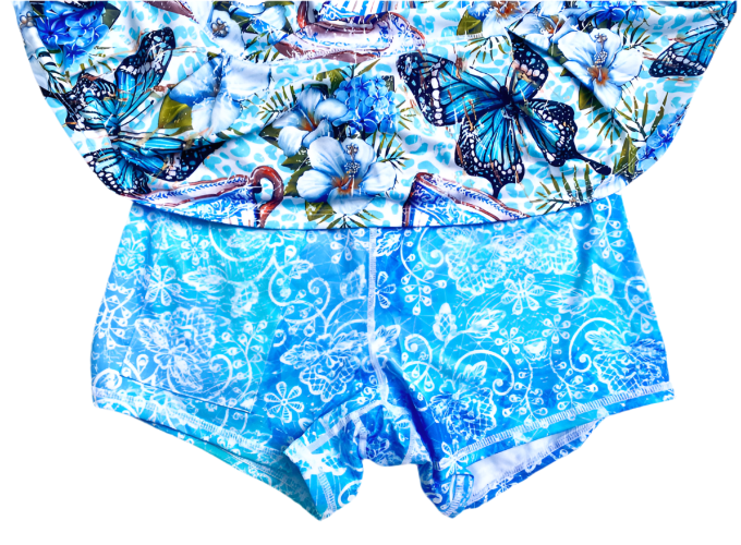Blue and white patterned outfit with butterfly design on a white background