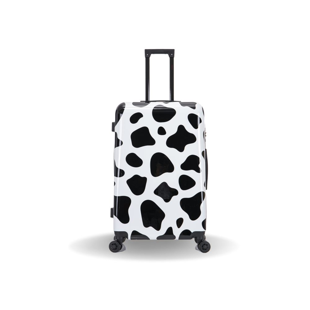 Black and white cow print suitcase on a white background