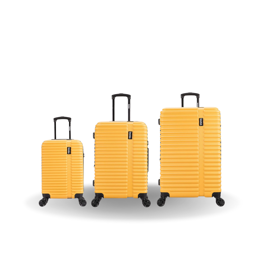Three yellow suitcases of different sizes on a white background
