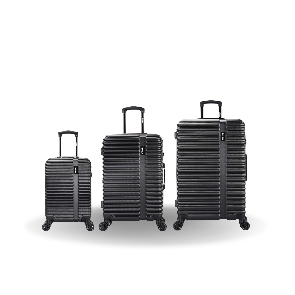 Three black suitcases of different sizes on a white background