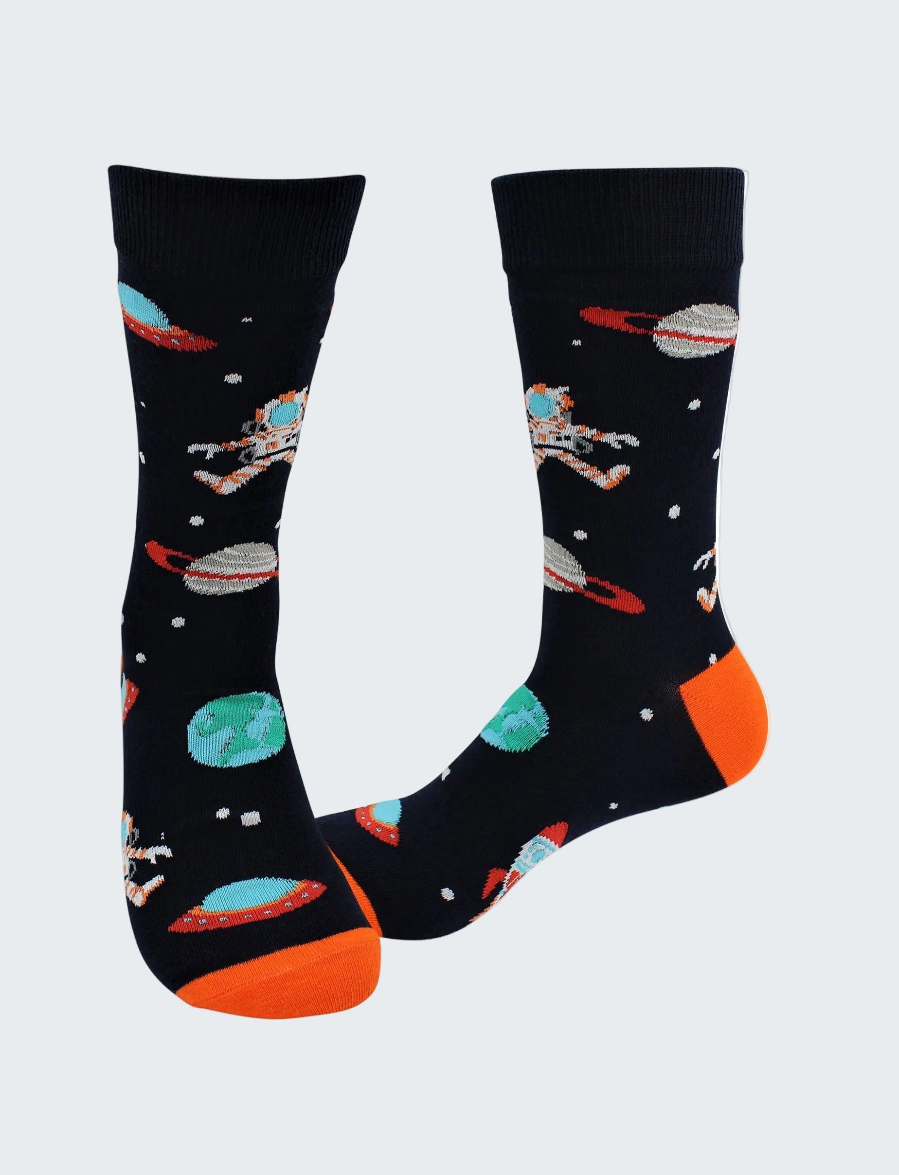 Space-themed socks with astronauts, planets, and UFOs on a black background.