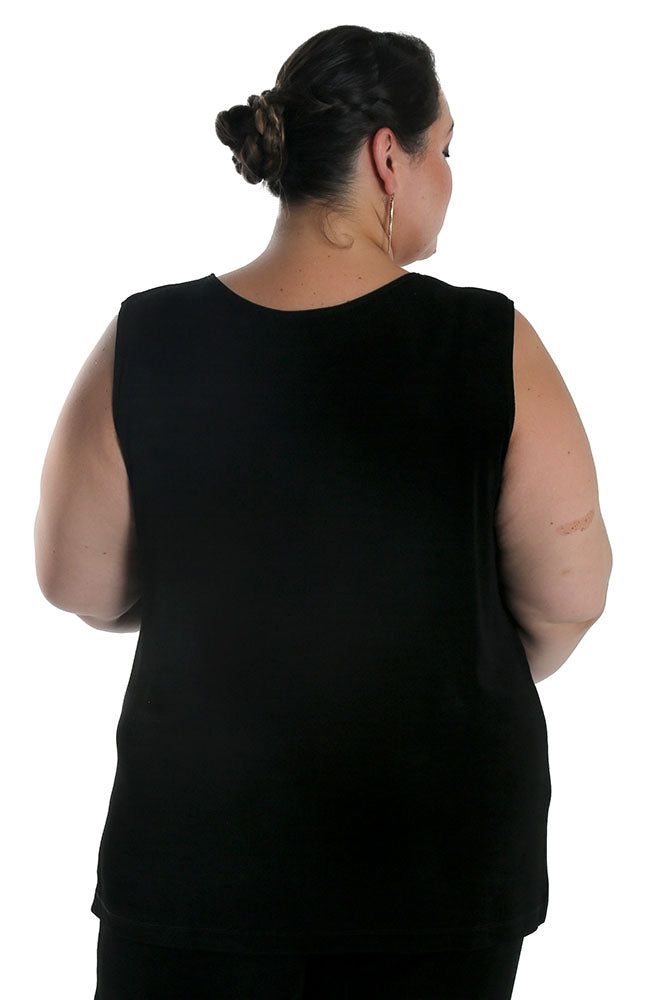 Person wearing a black sleeveless top on a white background