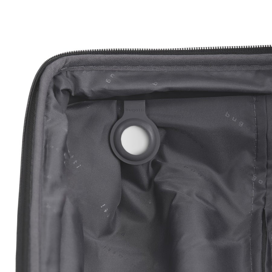 Close-up of a black suitcase with a valve on a white background