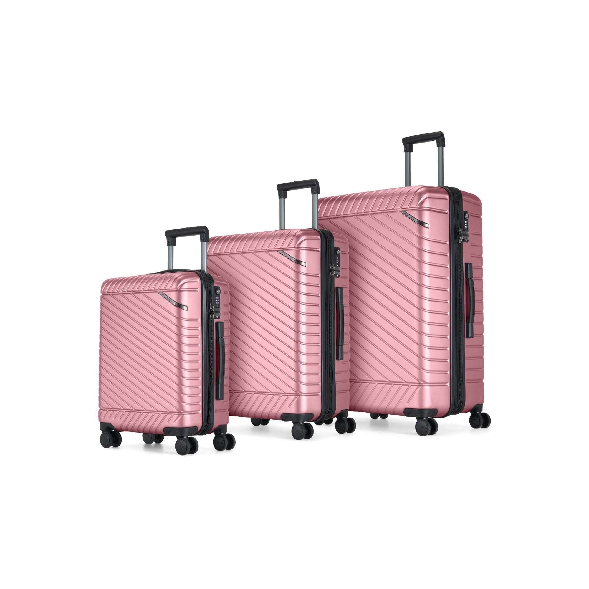 Set of three pink suitcases of different sizes on a white background