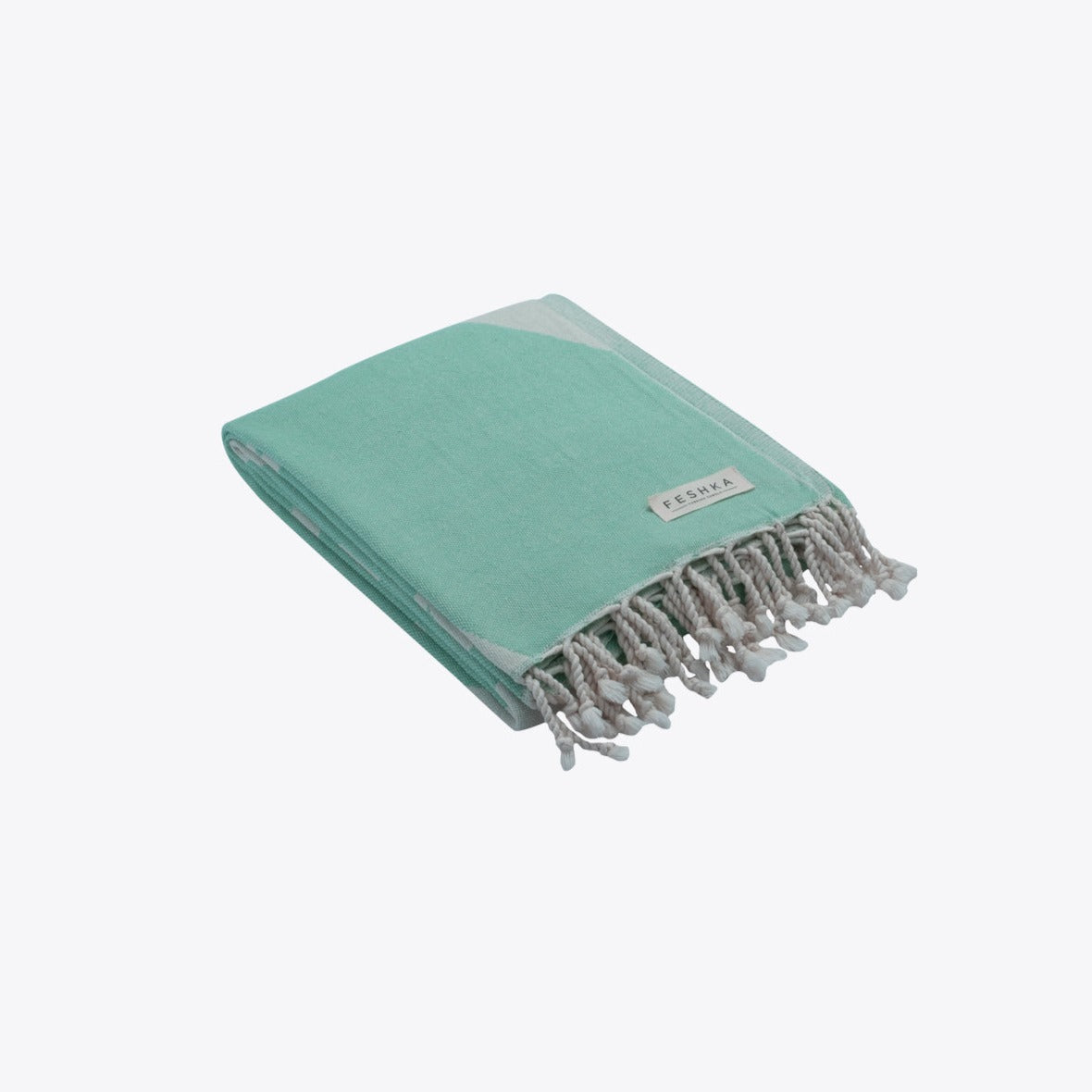 Turquoise towel with gray tassels on a white background