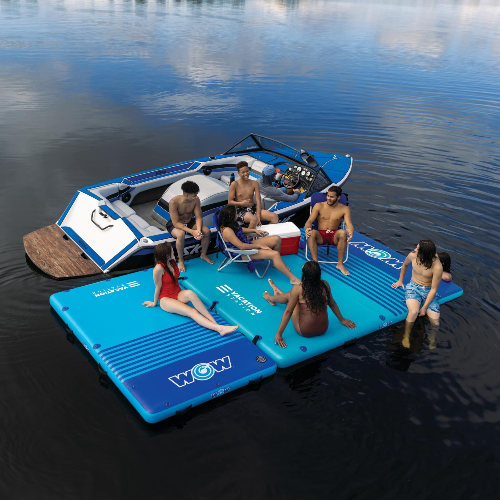 Inflatable water platform with people on a lake, featuring the WOW brand.