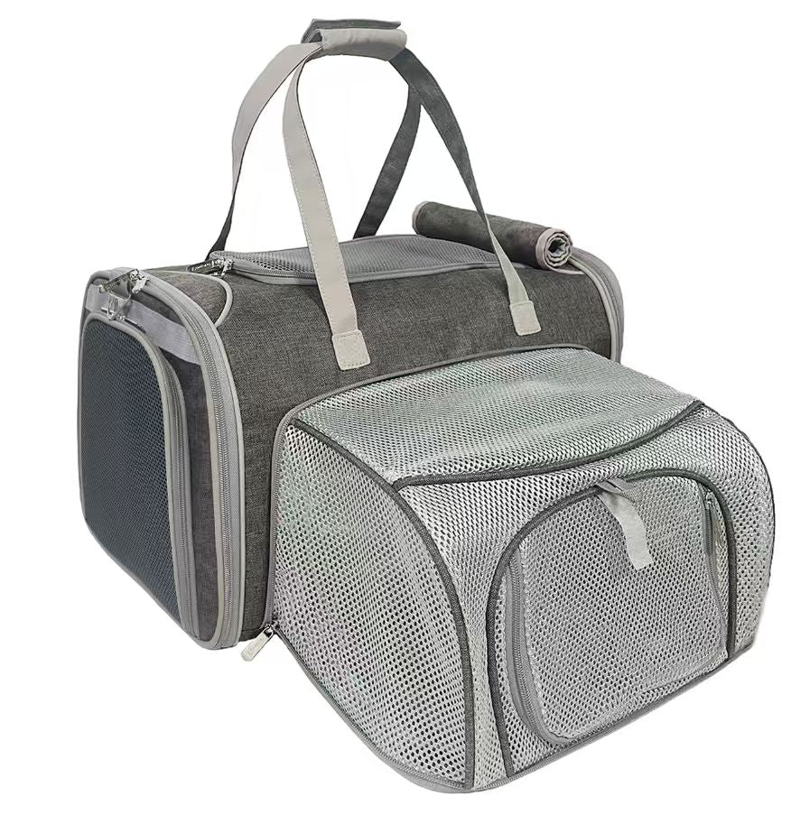 Gray pet carrier with mesh side on a white background