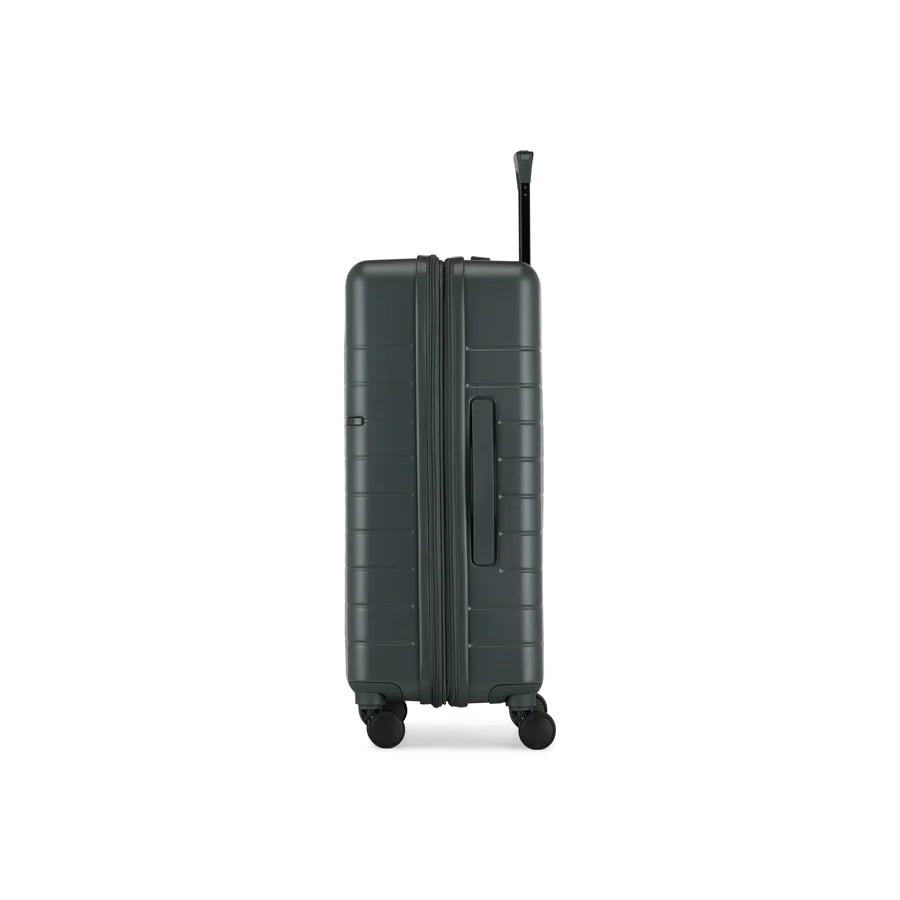 Dark gray suitcase with wheels on a white background