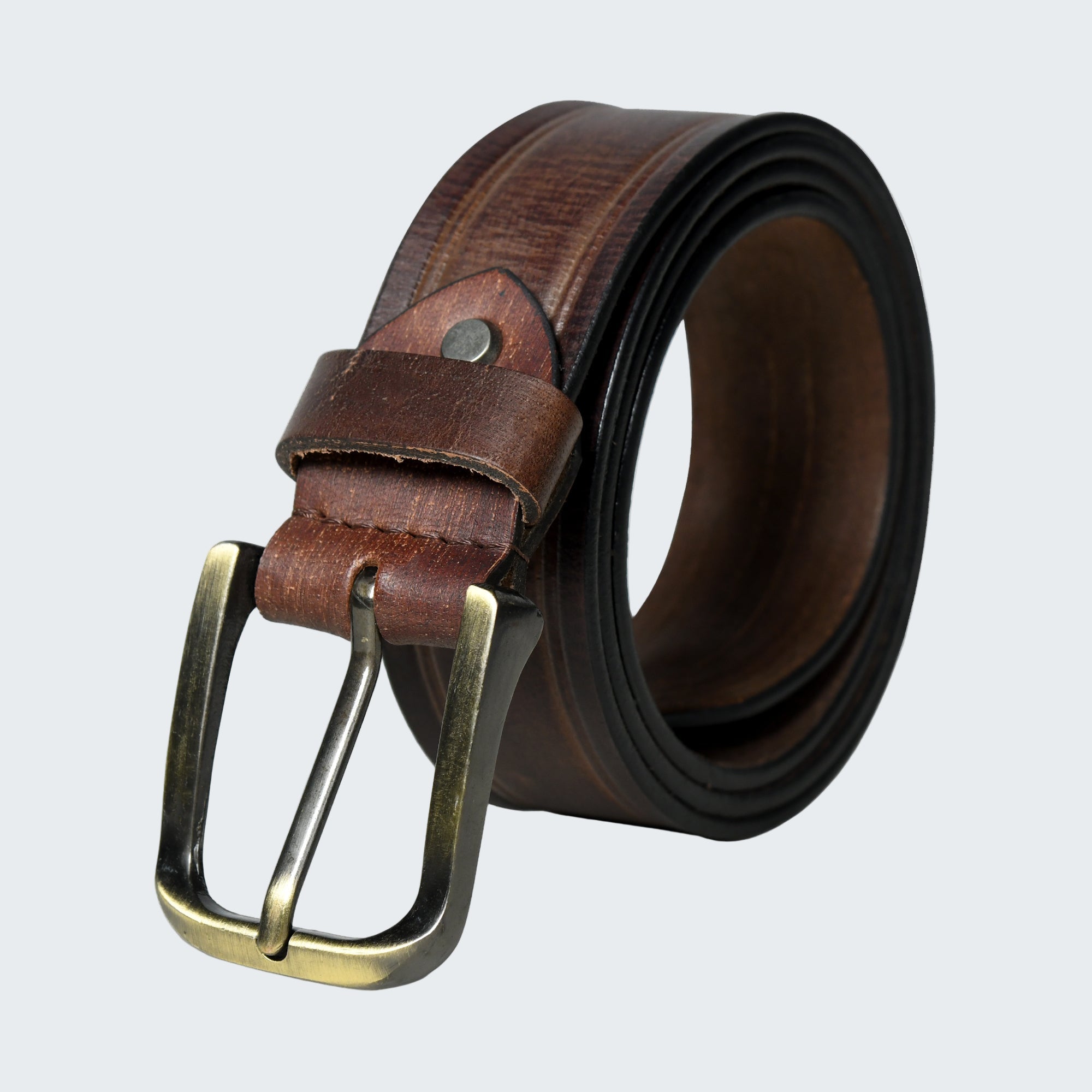 Brown leather belt with brass buckle on a white background
