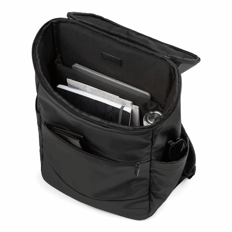 Black backpack with compartments and a laptop inside on a white background