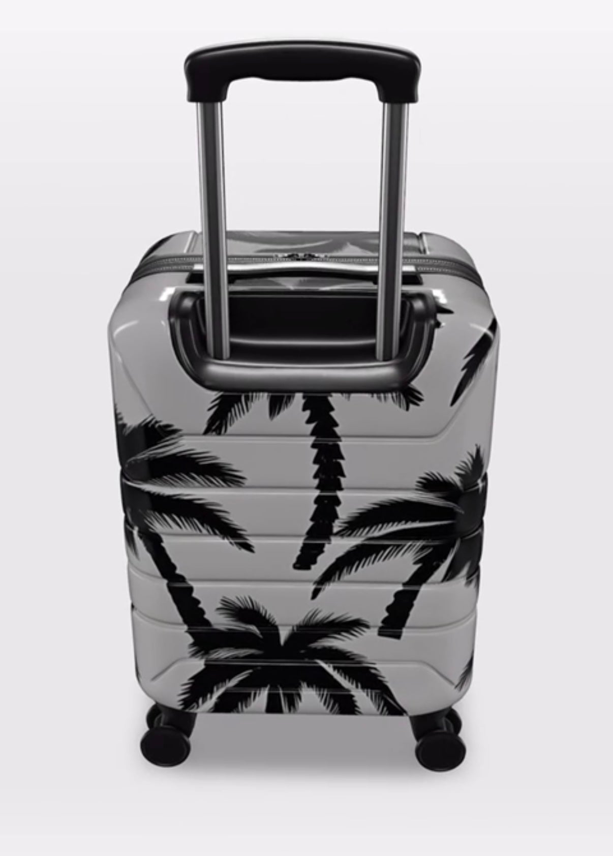 Suitcase with palm tree design on a white background