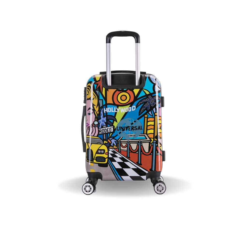Colorful suitcase with Hollywood-themed design on a white background