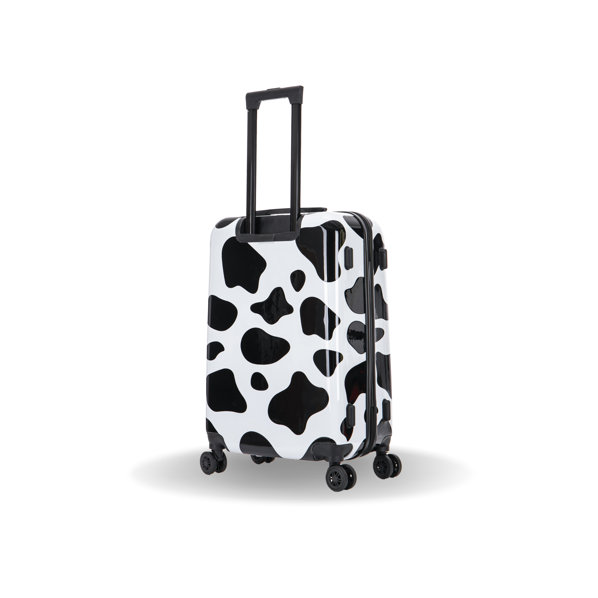 Black and white cow print suitcase on a white background