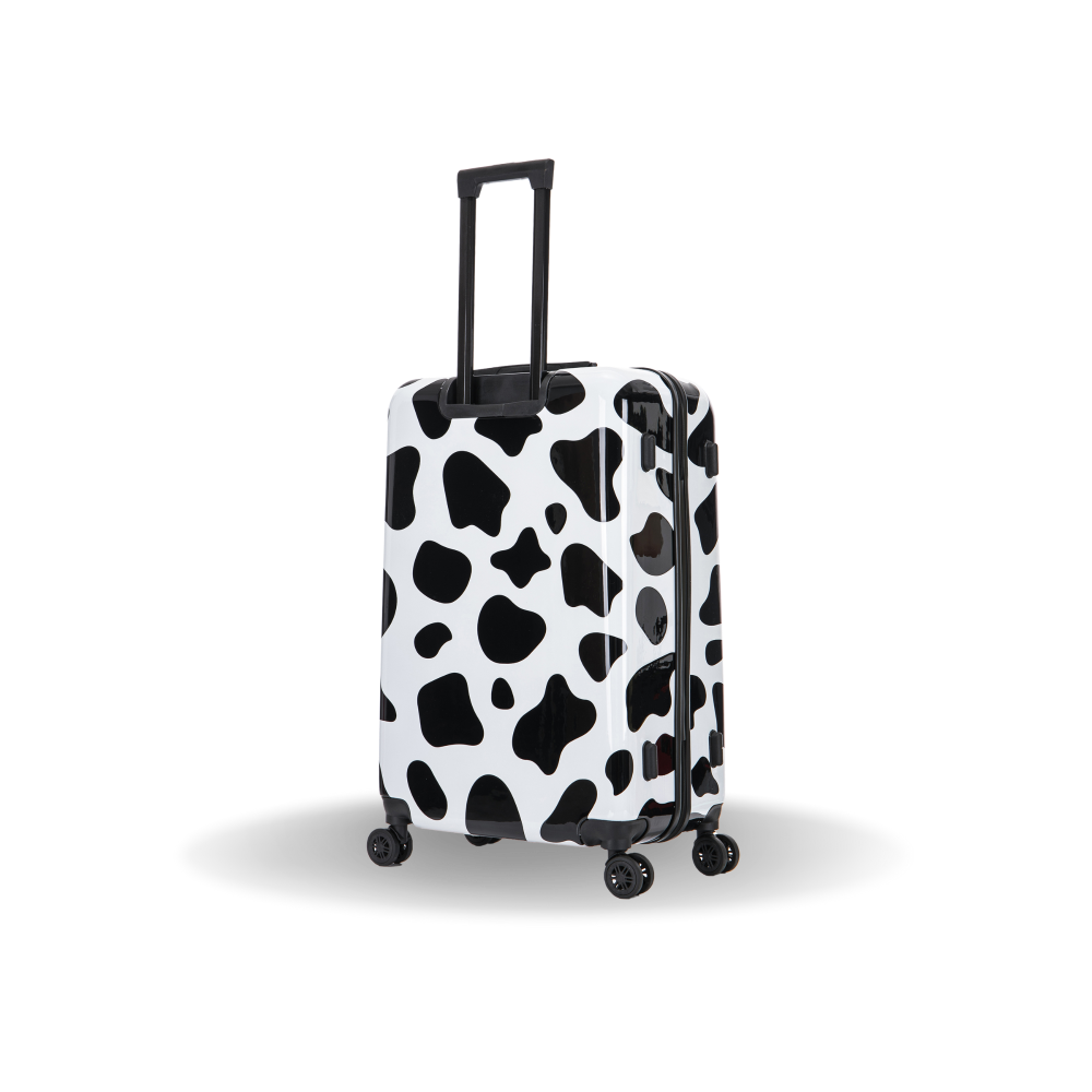 Black and white cow print suitcase on a white background