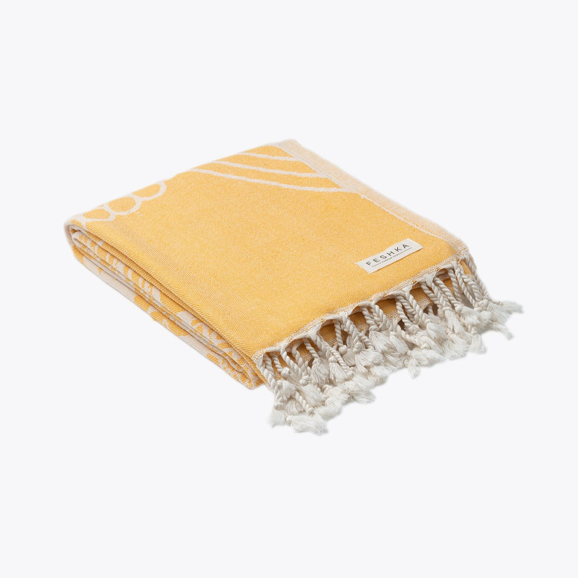 Yellow towel with white fringe on a white background