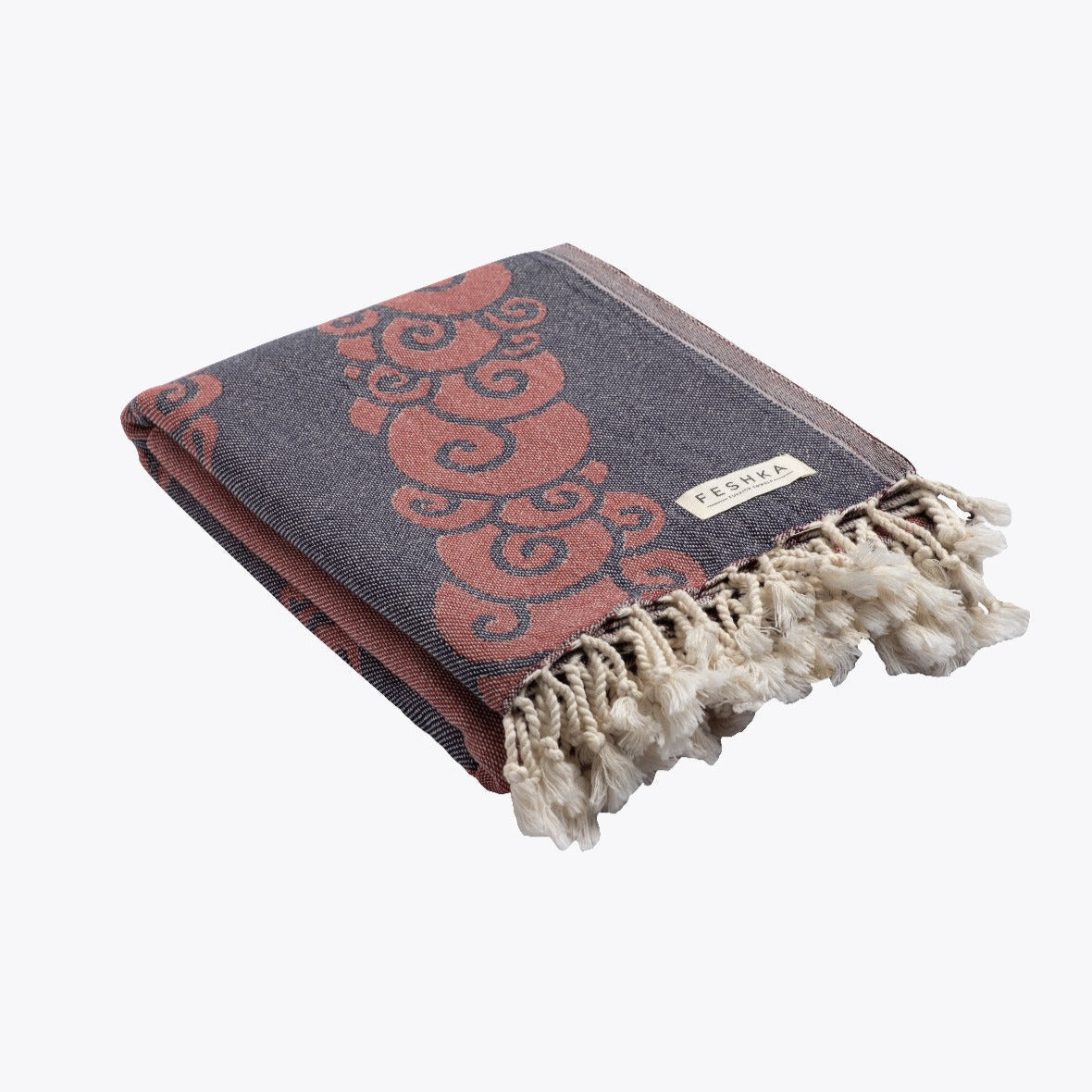 Gray and red patterned towel with tassels on a white background