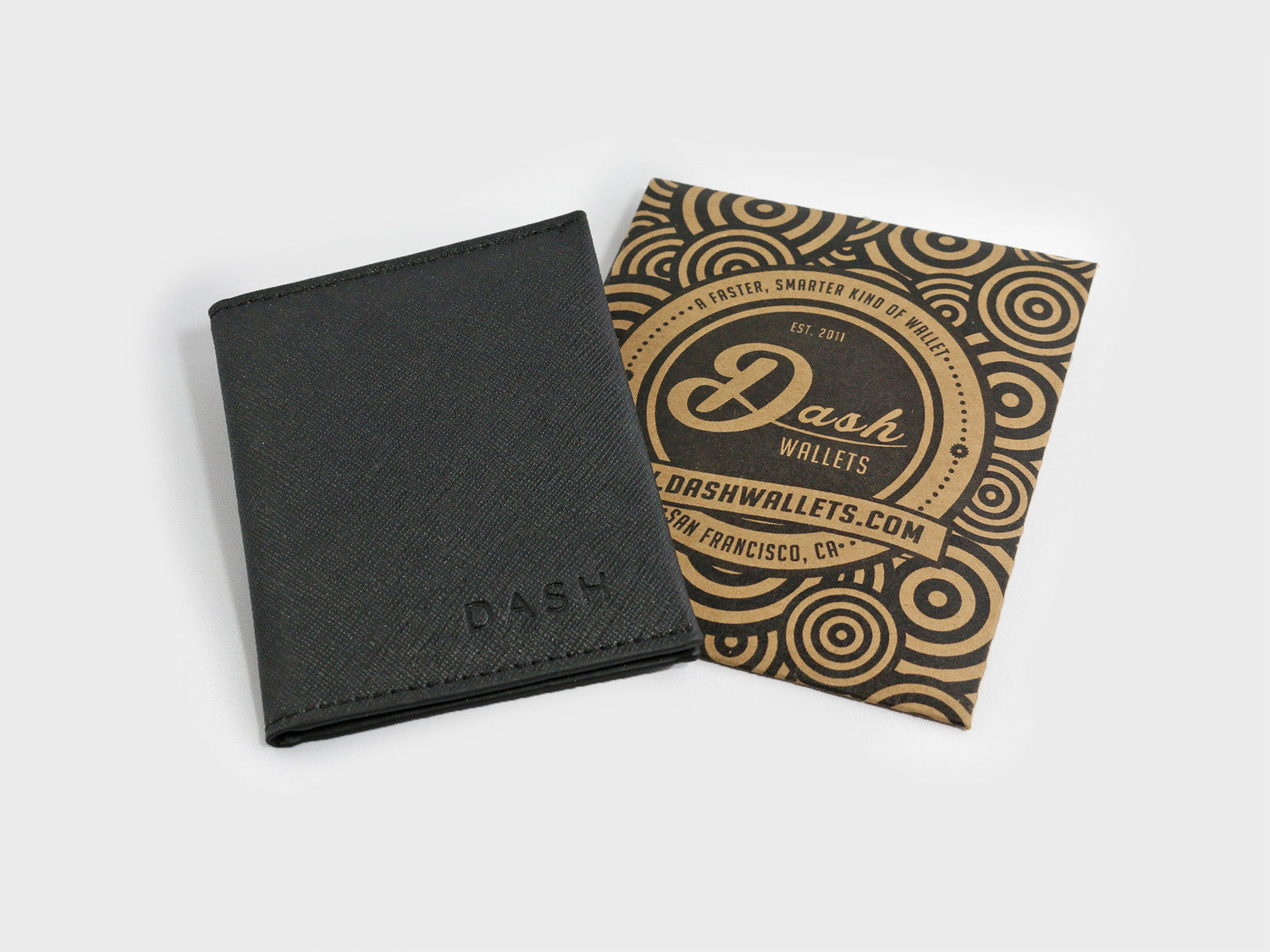 Black wallet and branded box with 'Dash Wallets' on a light gray background