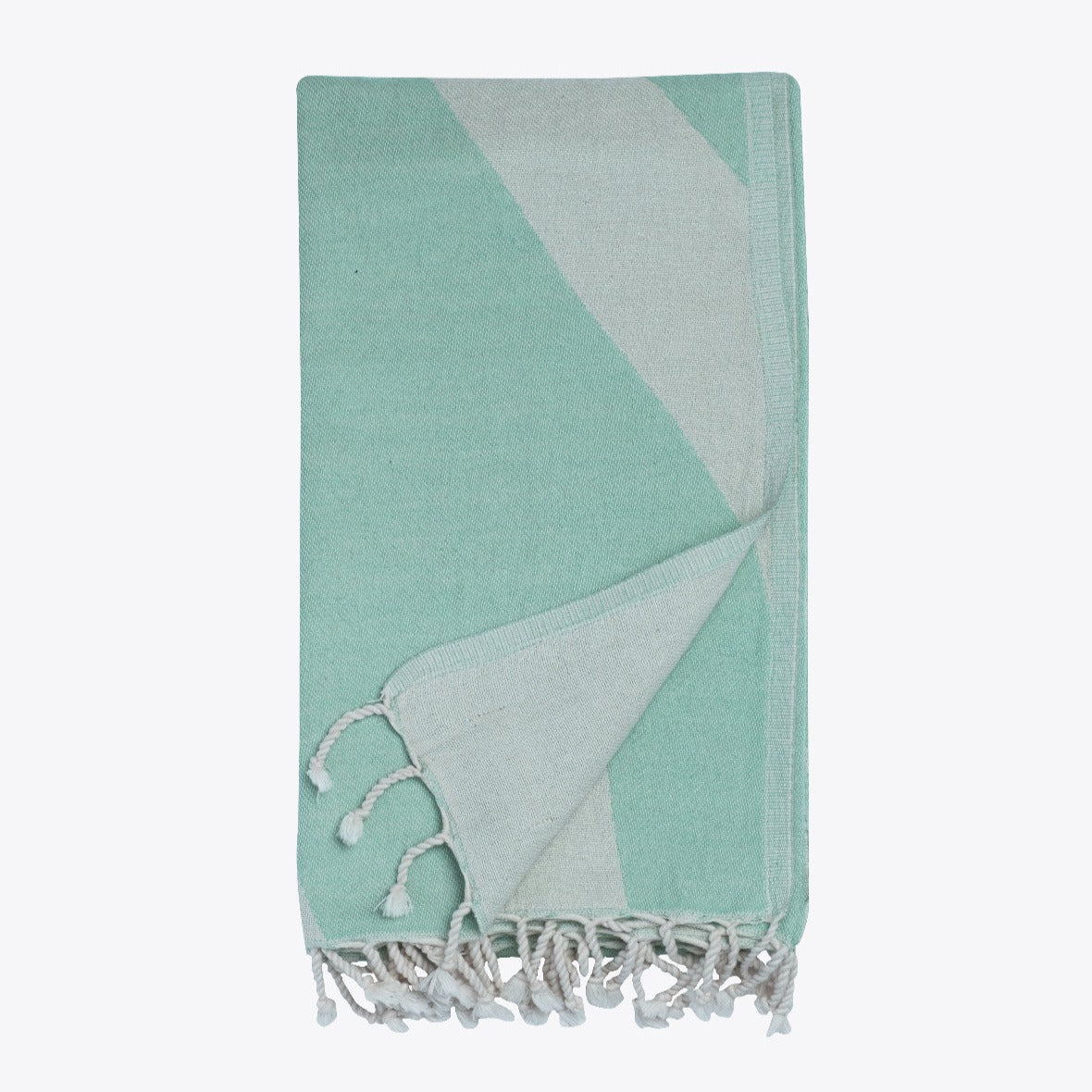 Mint green and gray towel with tassels on a white background