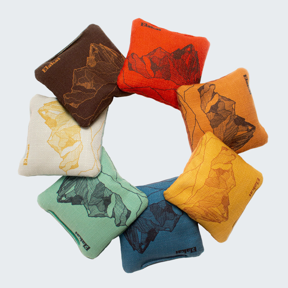 Set of colorful bean bags with bear designs on a white background