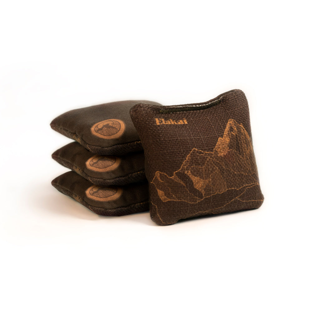 Set of brown leather archery bags with 'Elkadat' branding on a white background