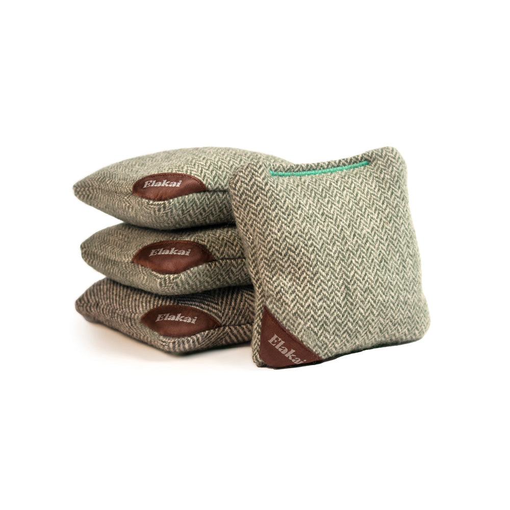 Four green and brown bean bags with 'Elakai' branding on a white background