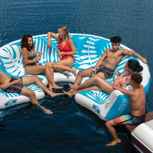 Group of people relaxing on inflatable lounge chairs in the water