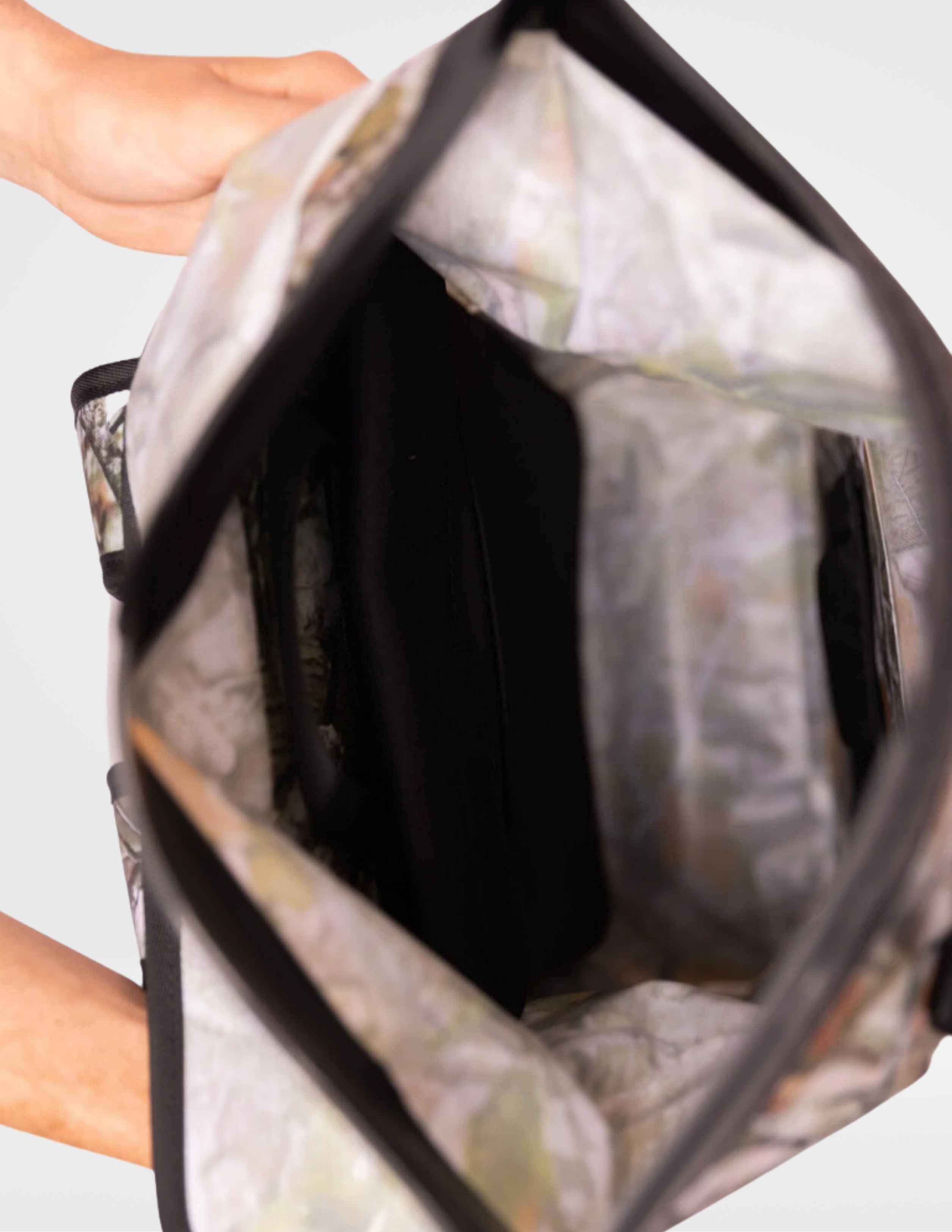 Close-up of a floral-patterned handbag with a white background
