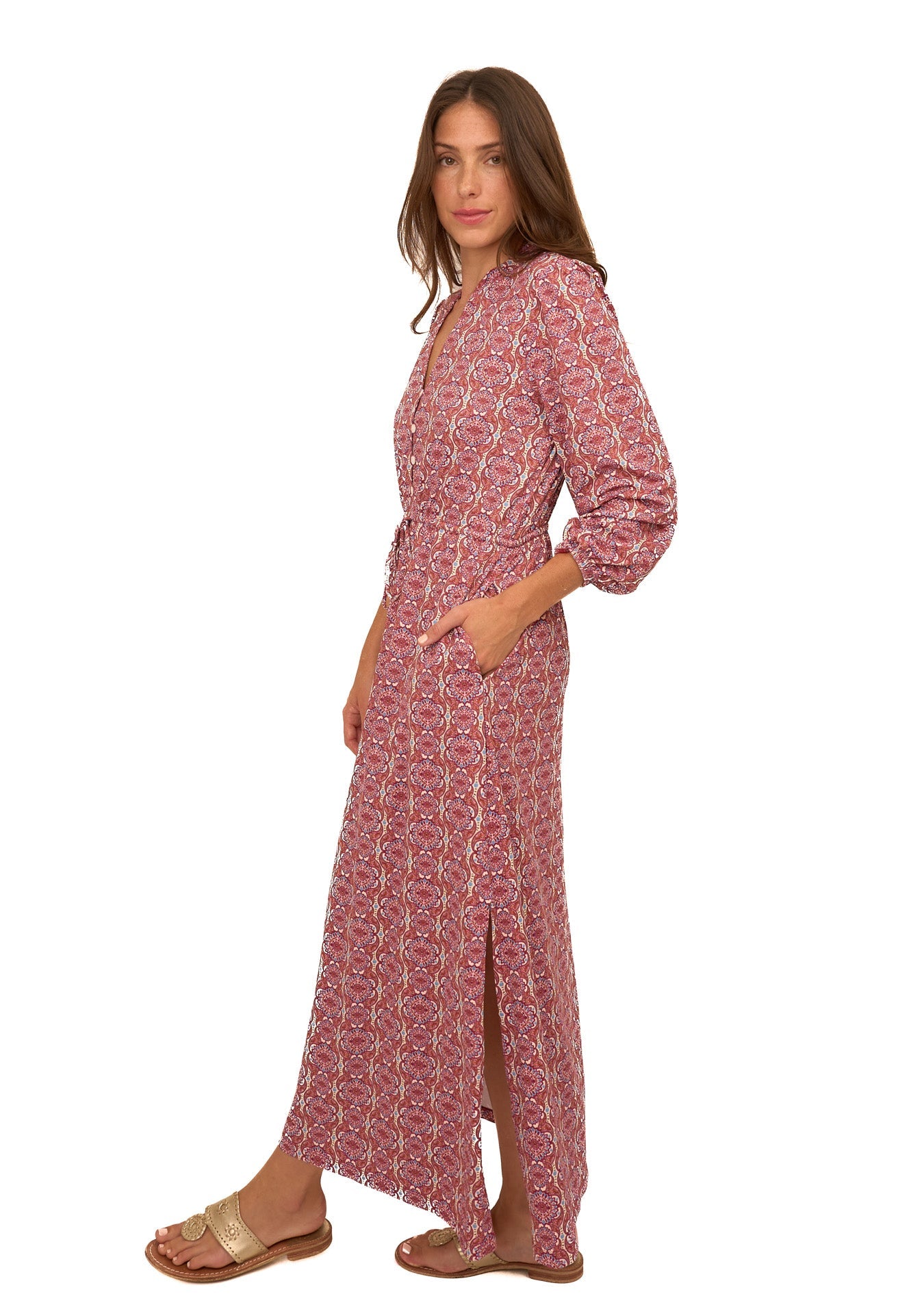 Woman wearing a red patterned dress on a white background