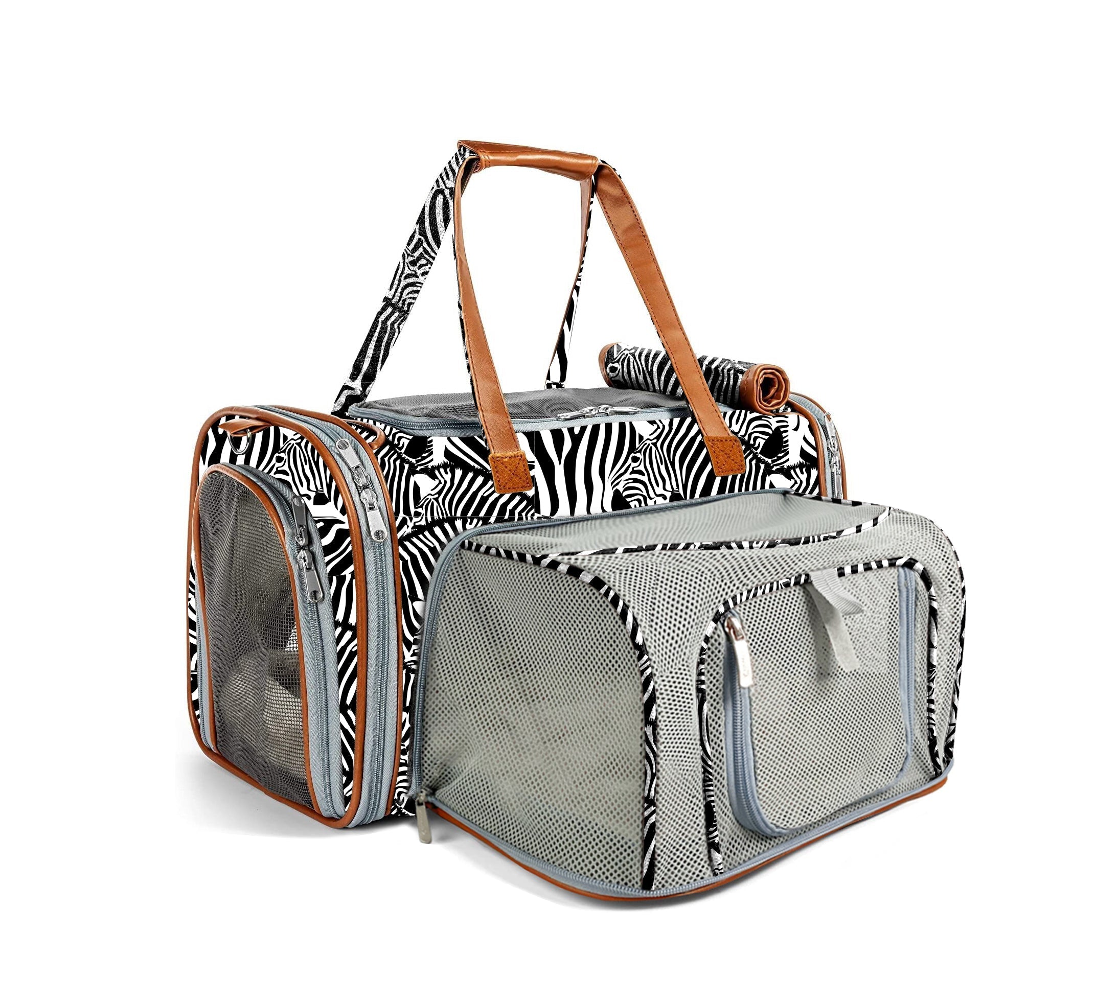 Pet carrier with zebra print and brown leather straps on a white background