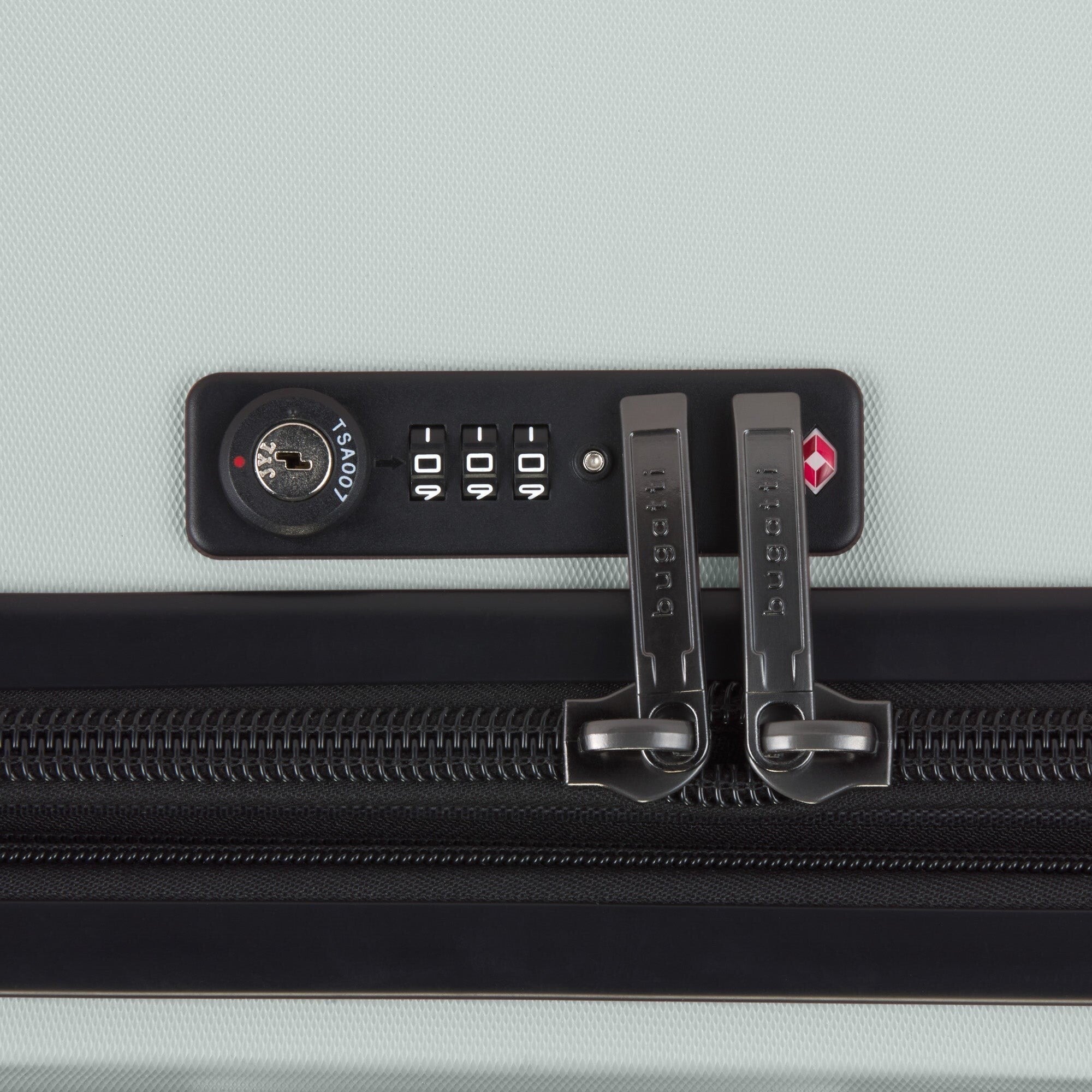 Close-up of a suitcase with a combination lock on a light gray background