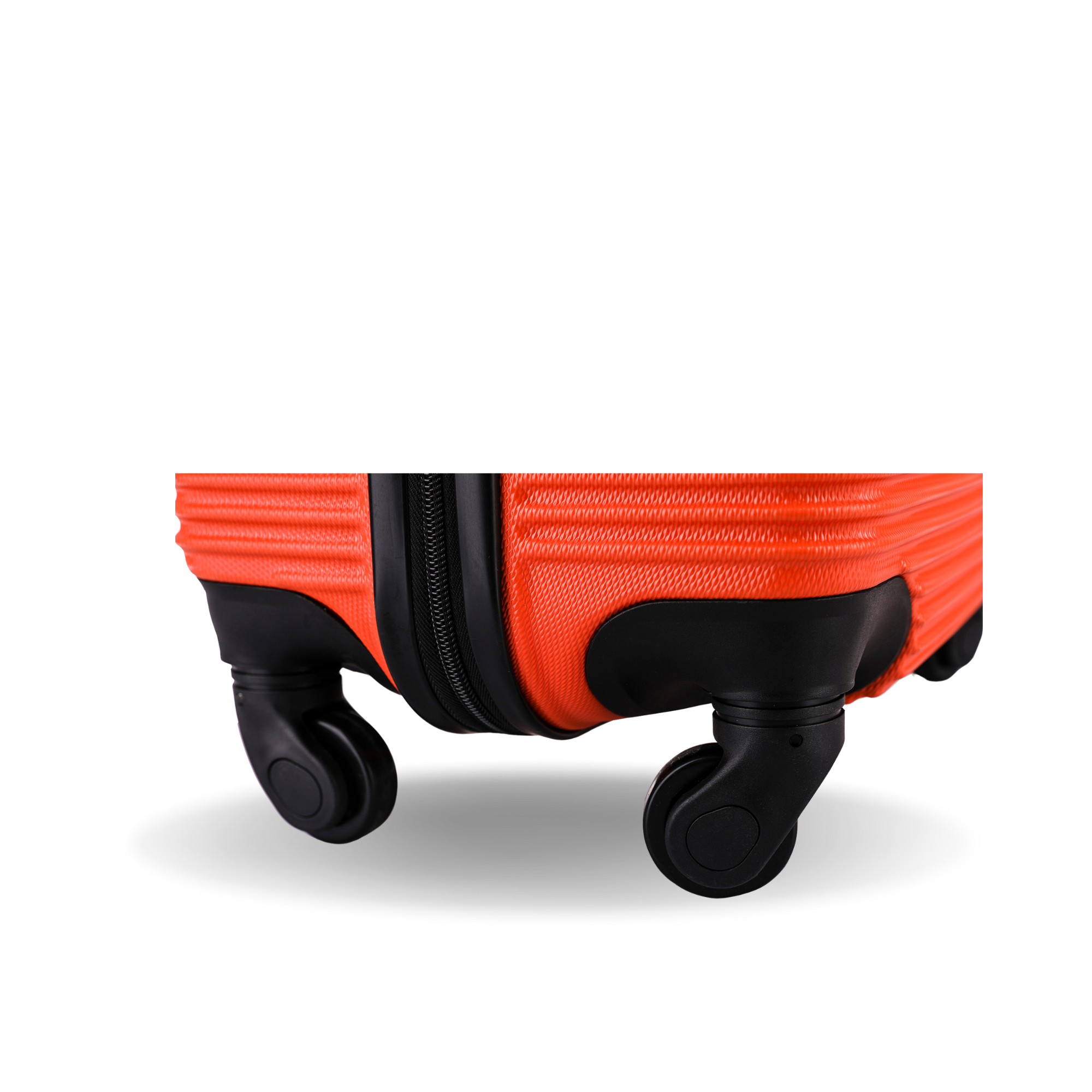 Close-up of a red suitcase with black wheels on a white background