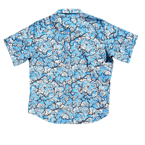Short-sleeve shirt with blue and white floral pattern on a white background