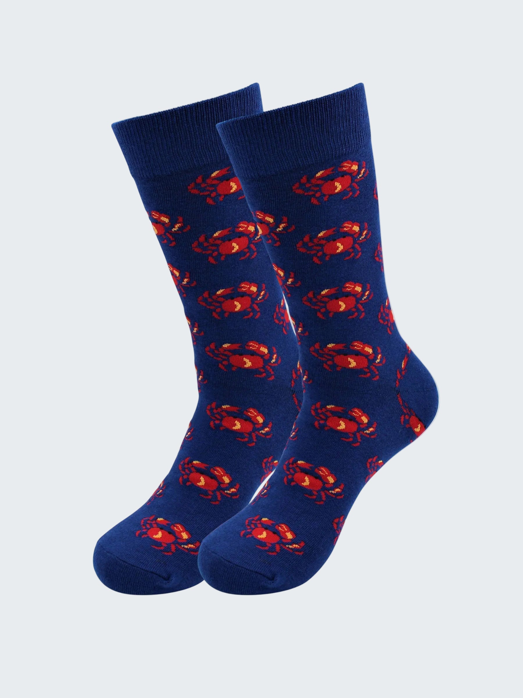 Pair of blue socks with red crab pattern on a white background