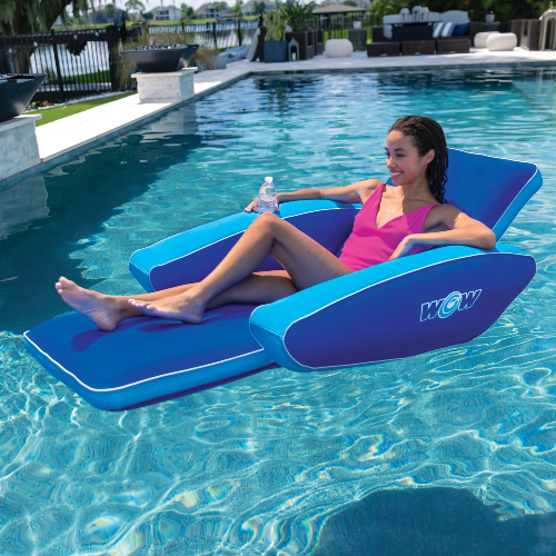 Woman lounging on a blue inflatable pool lounger in a pool.