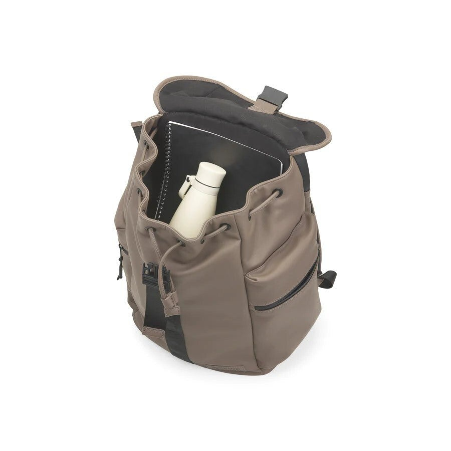 Brown backpack with a black interior and a white bottle inside on a white background