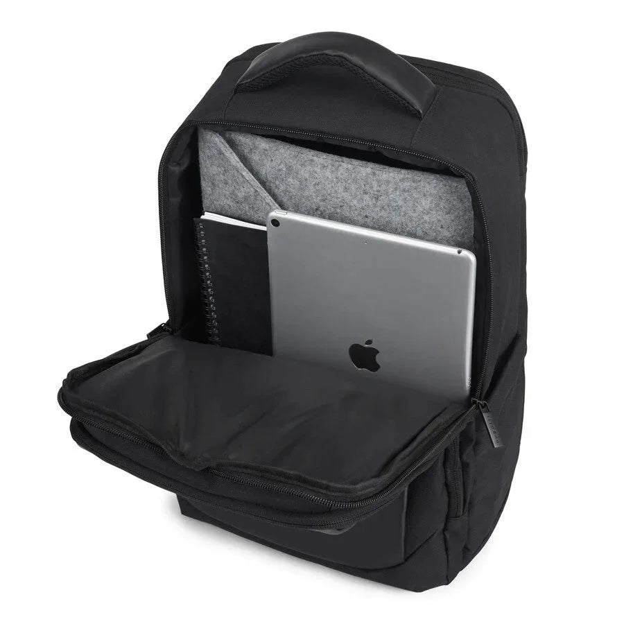 Black backpack with a laptop and notebook inside on a white background
