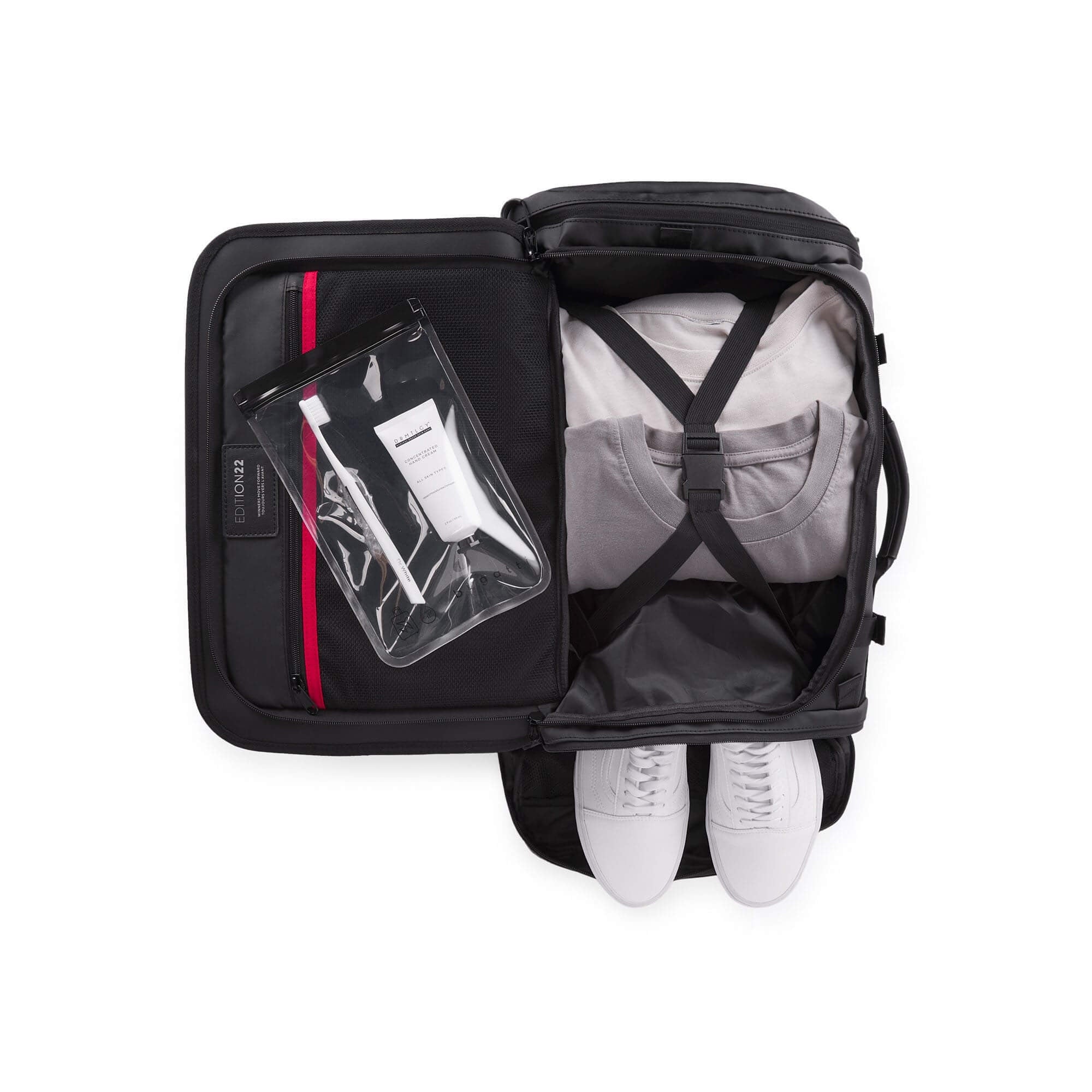Black backpack with white shoes and a clear pouch on a white background