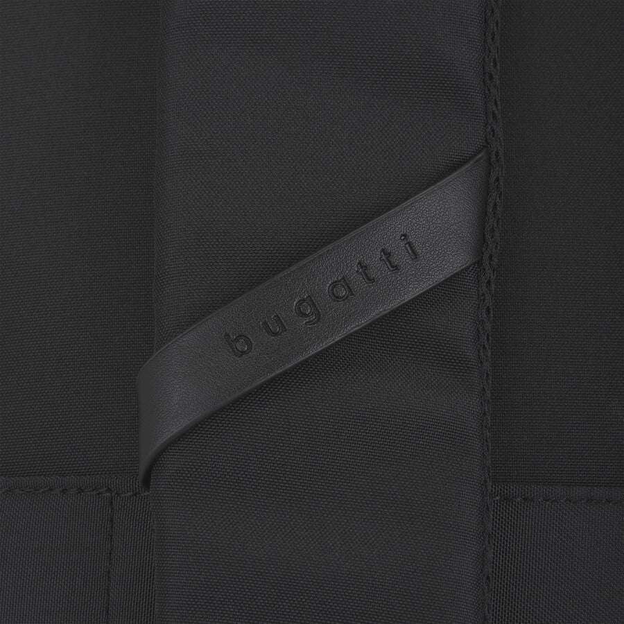 Close-up of a black fabric with a Bugatti logo on a strap.