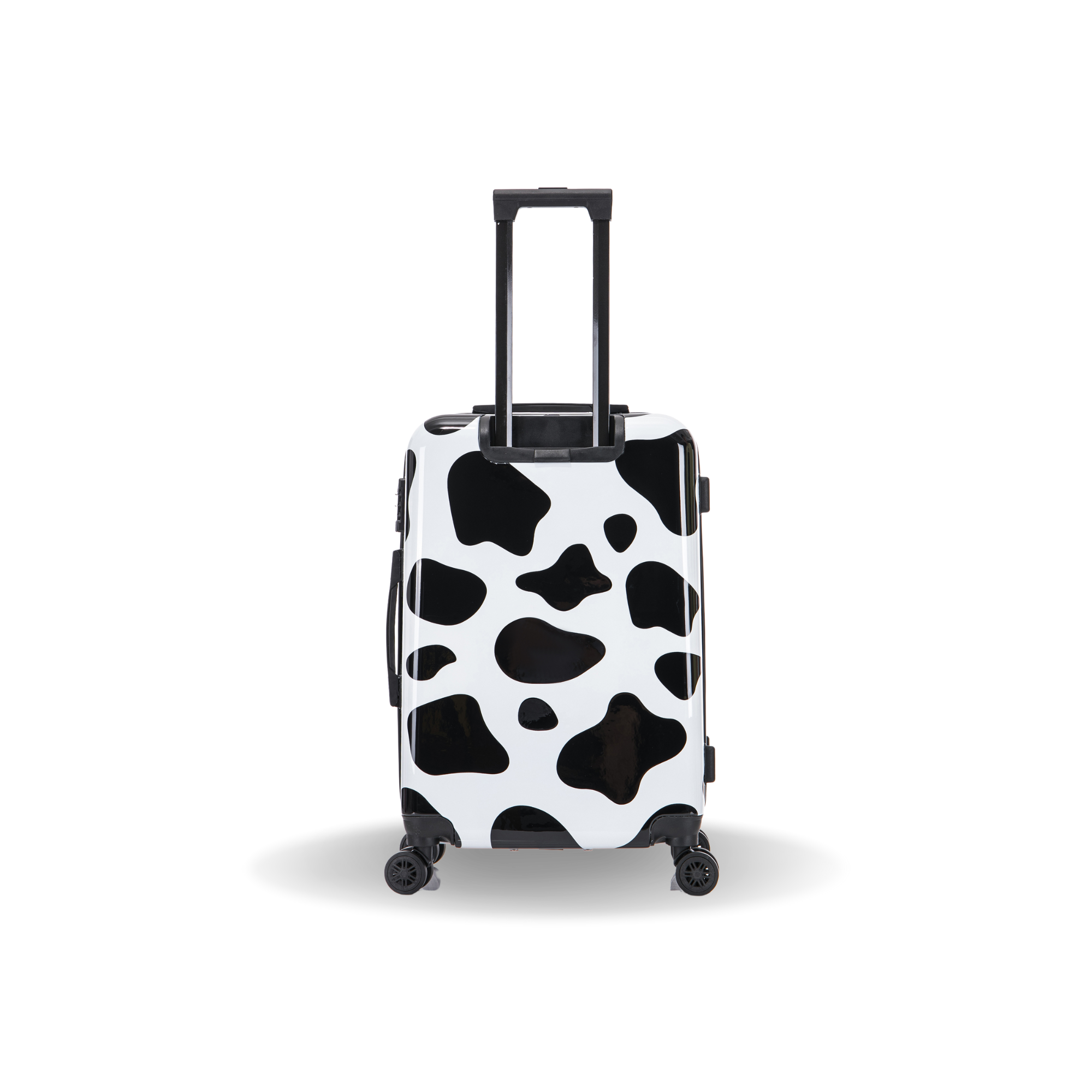 Black and white cow print suitcase on a white background