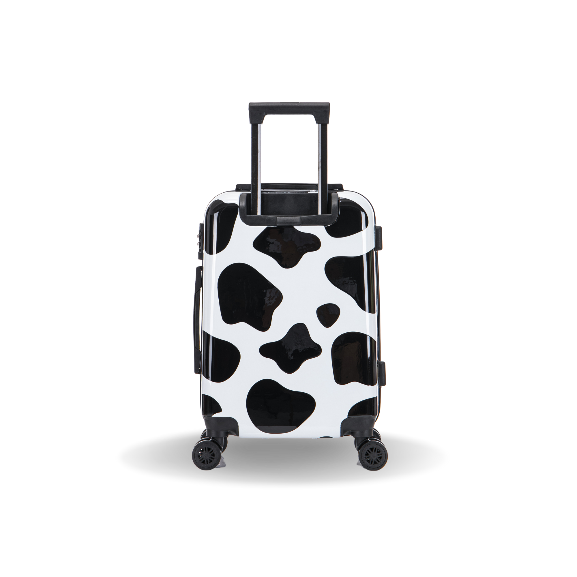 Black and white cow print suitcase on a white background