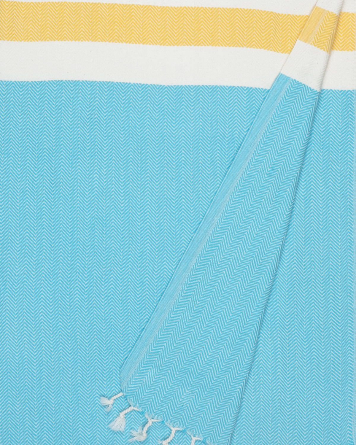 Blue towel with yellow and white stripes