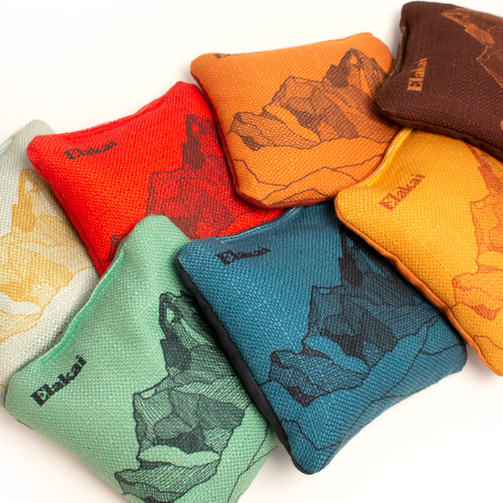 Colorful bean bags with bear designs on a white background
