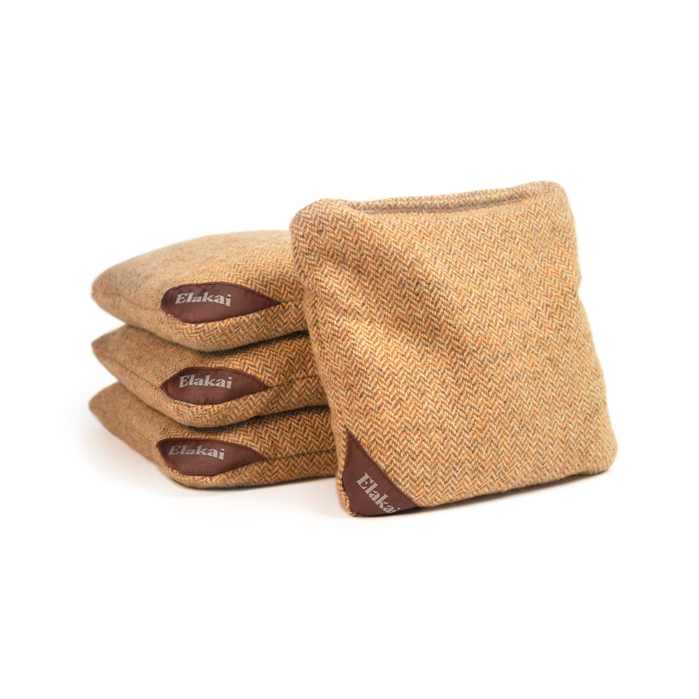 Set of brown herringbone fabric bags with 'Elakai' branding on a white background