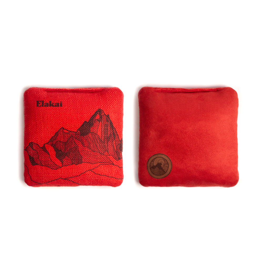 Two red bean bags with mountain design and Elakali branding on a white background