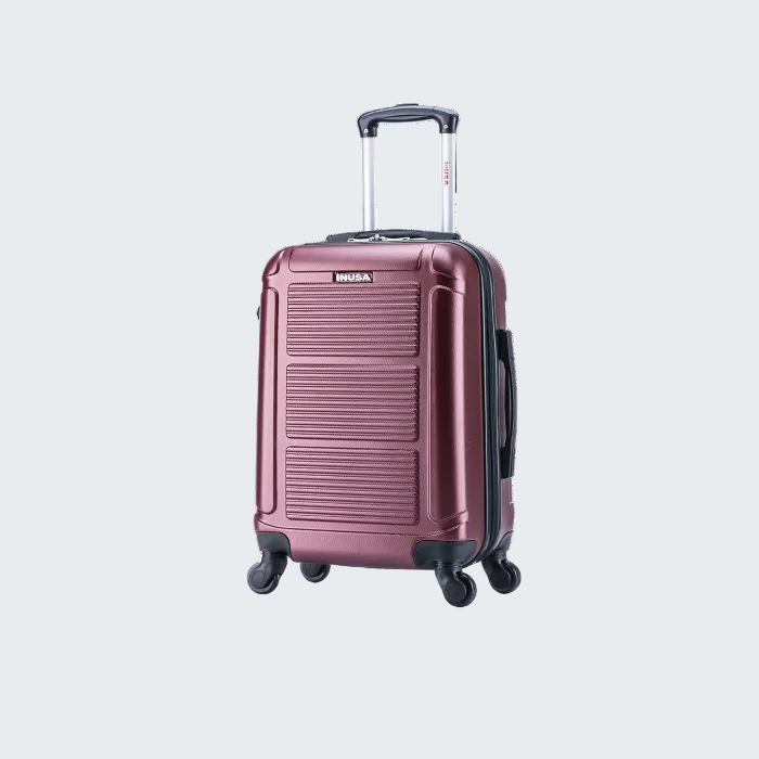Rose gold suitcase with 'Nun"a' branding on a white background