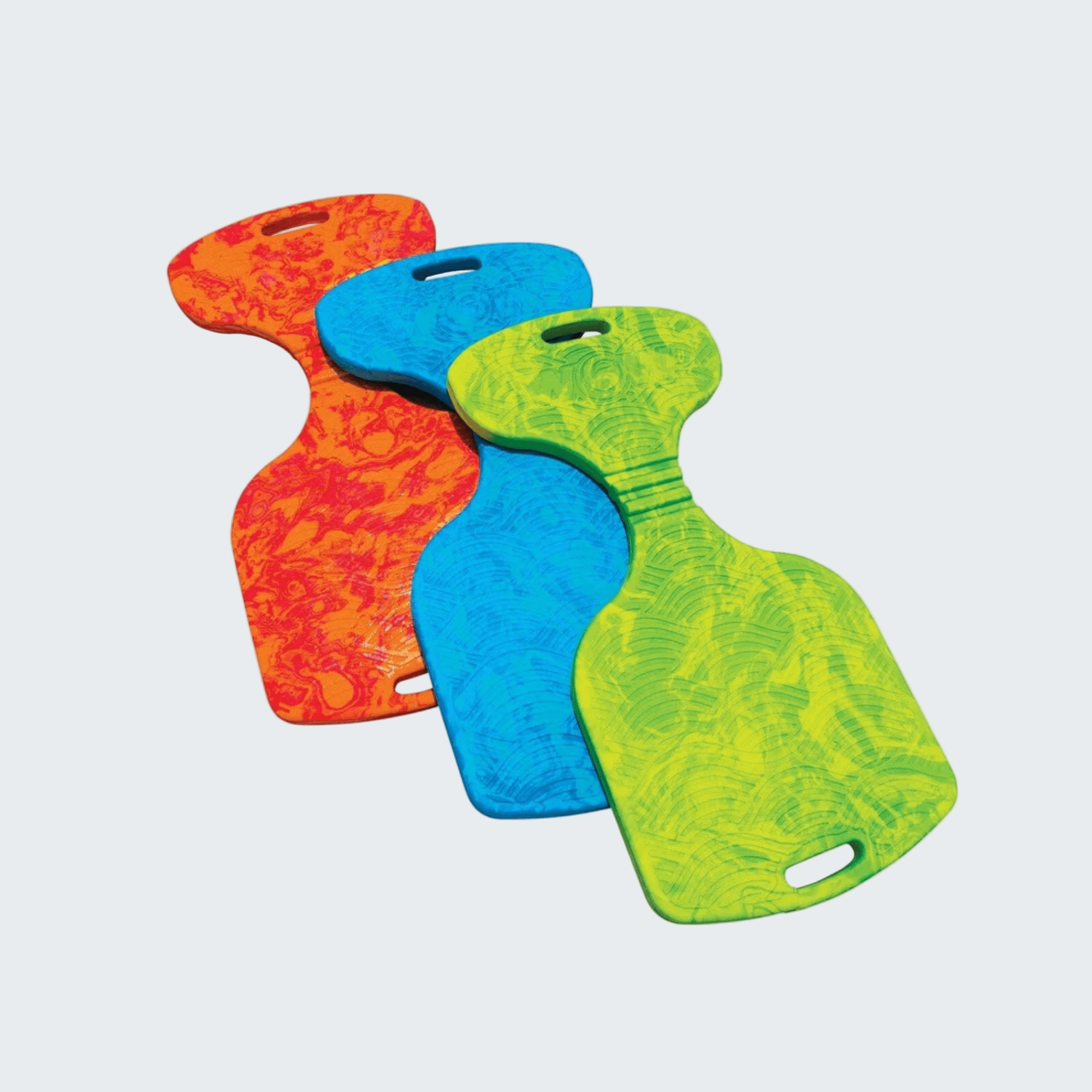 Three colorful plastic paddles in red, blue, and green on a white background