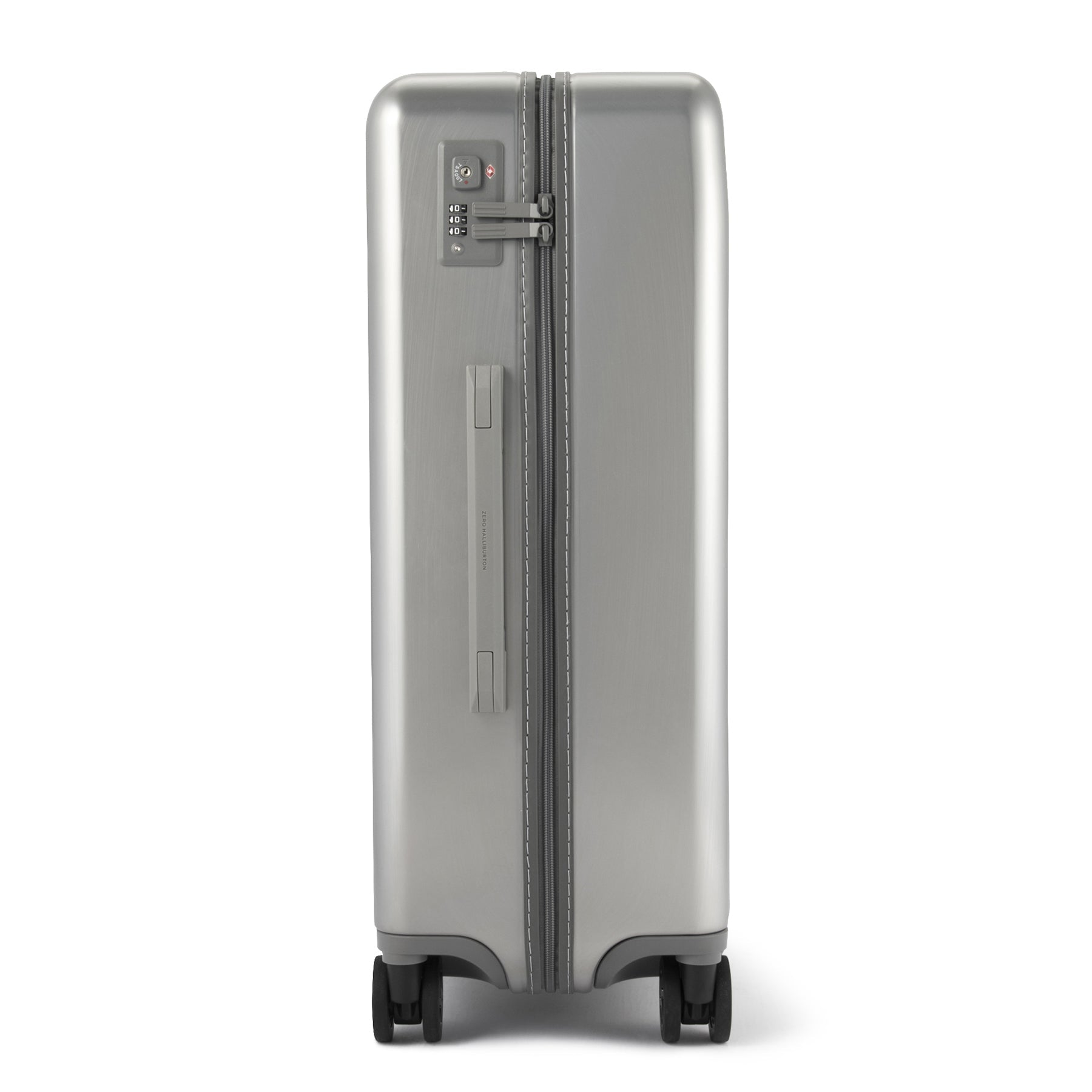 Silver suitcase with a clear handle on a white background